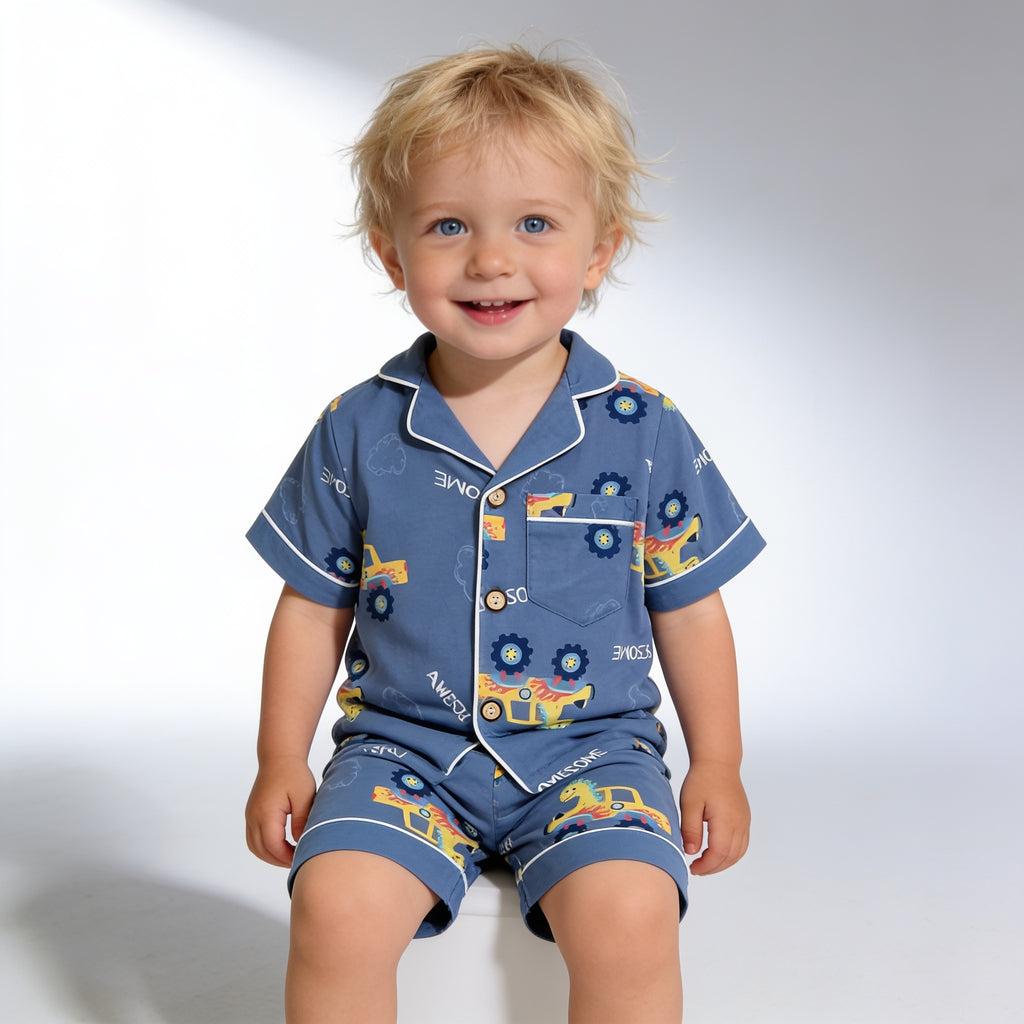 Pyjama boutonne court - marine dinosaures - porte par un enfant - Candy Bebe