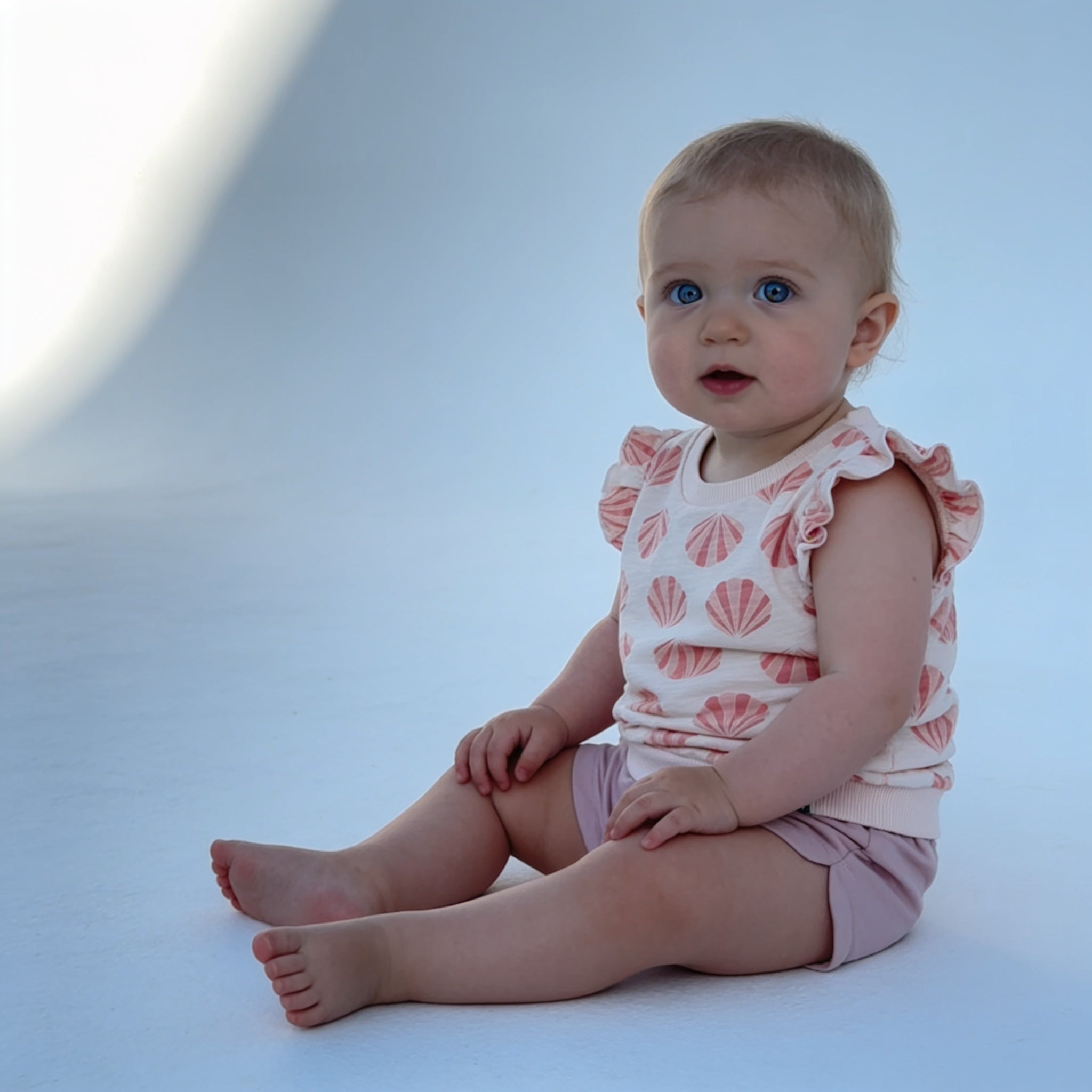 Ensemble volante coquillages - rose - porte par un enfant - Candy Bebe